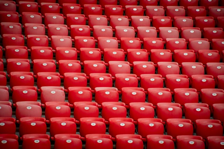 View of Red Plastic Chairs in the Grandstands at the Stadium